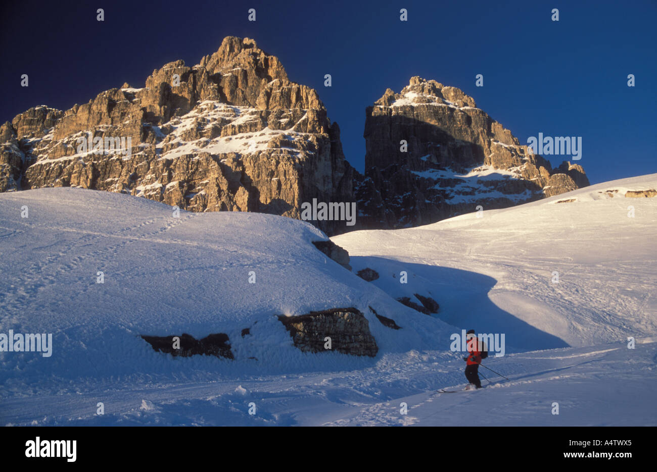 Skier on south side of Tre Zime Drei Zinnen winter Sextener Dolomite mountains Alto Adige South Tyrol Italy Model released Stock Photo