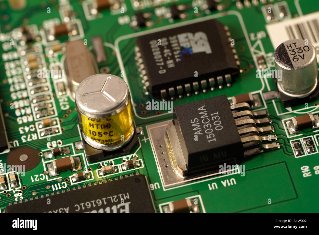 Microchips and Electronic Components on a Circuit Board, Close Up. Stock Photo