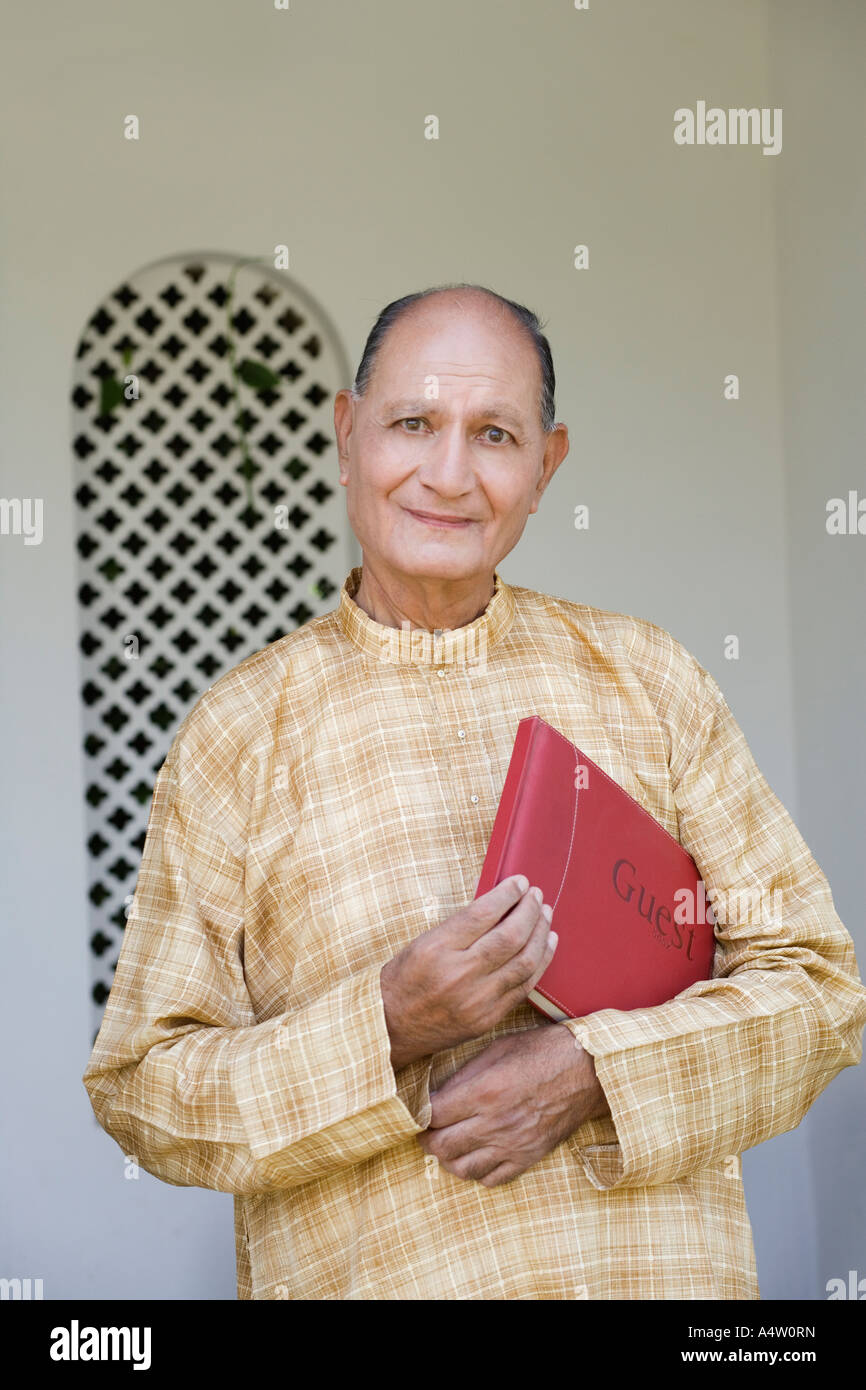 Man holding guest book Stock Photo