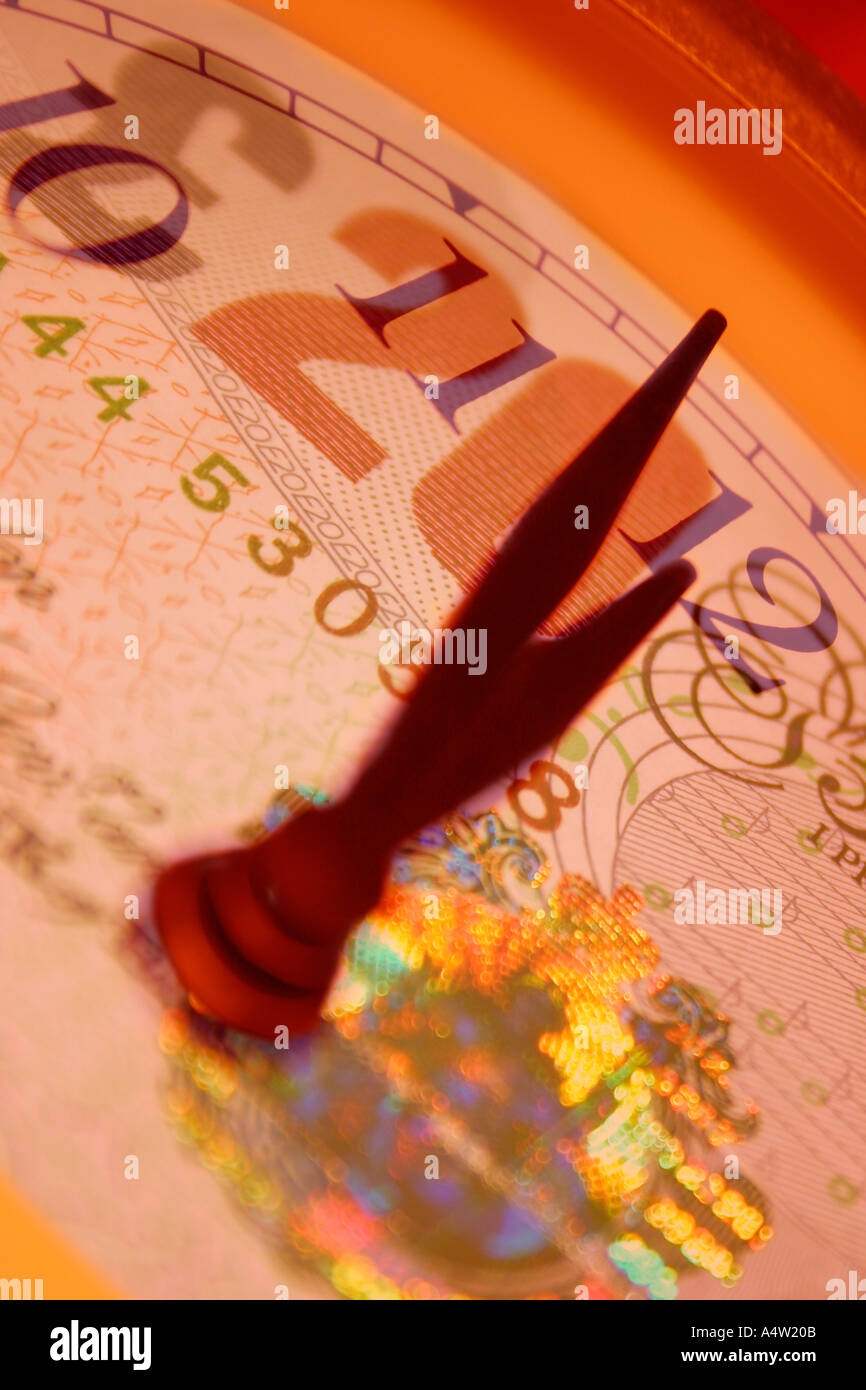 Time is Money Clock face with 20 pounds sterling note Stock Photo - Alamy
