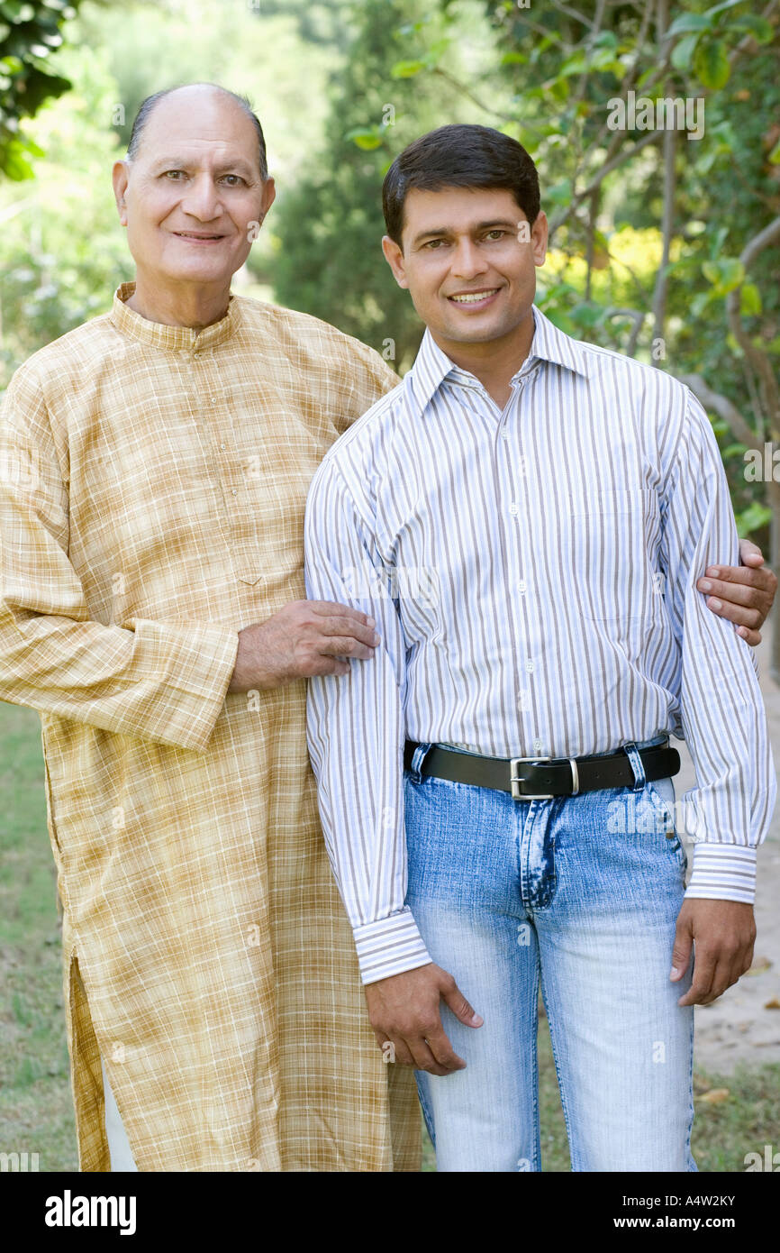 Indian man hugging son smiling hi-res stock photography and images - Alamy