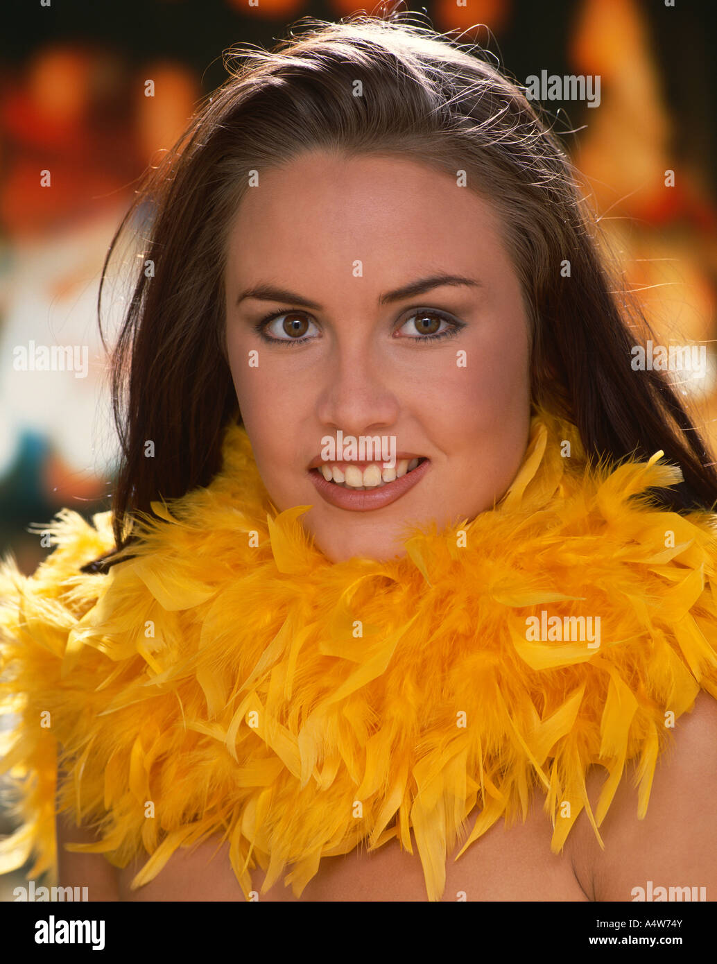 JANIE DICKENS IN YELLOW FEATHERED BOA Stock Photo