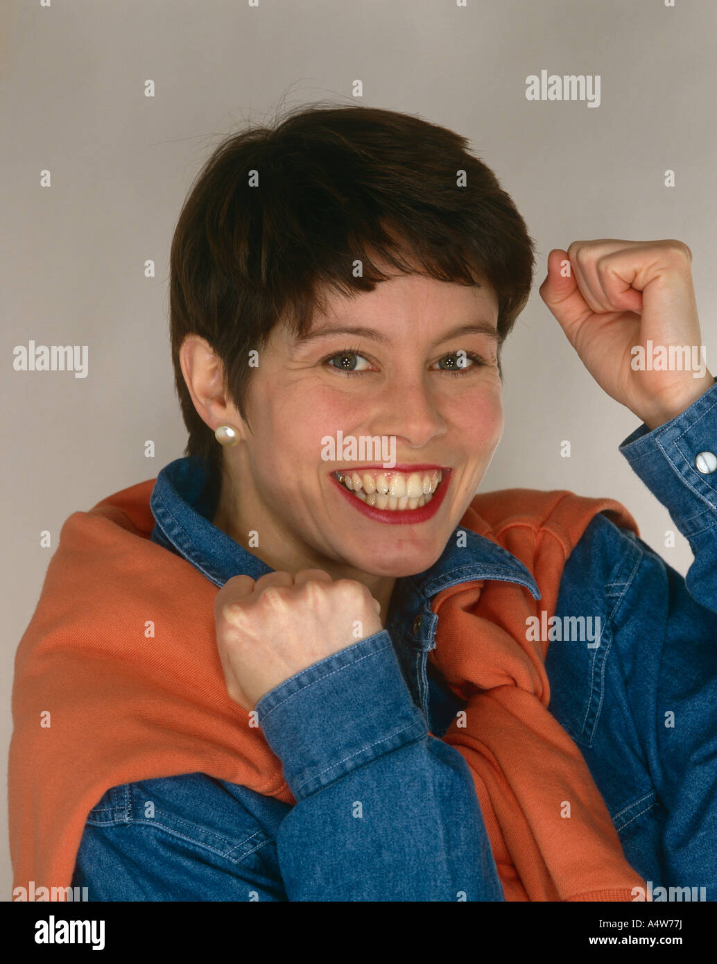 GIRL SHORT HAIR HOLDING UP CLENCHED FIST Stock Photo Alamy