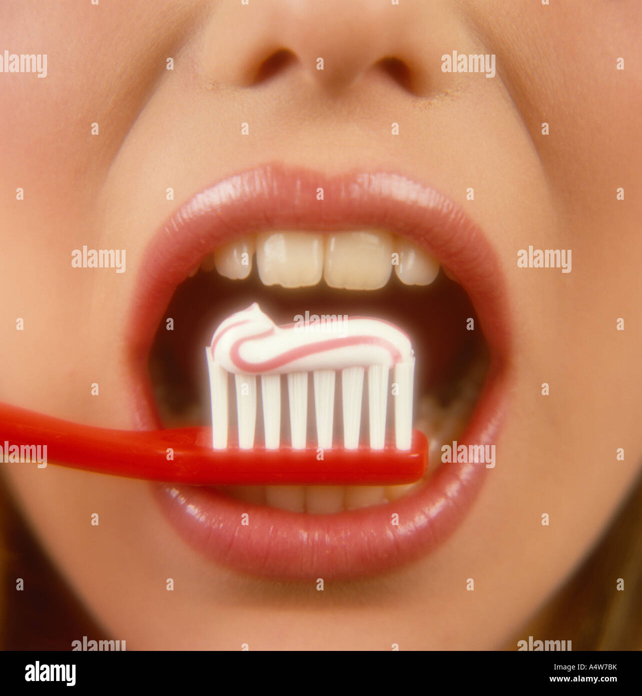GIRL S MOUTH WITH TOOTHBRUSH PASTE Stock Photo
