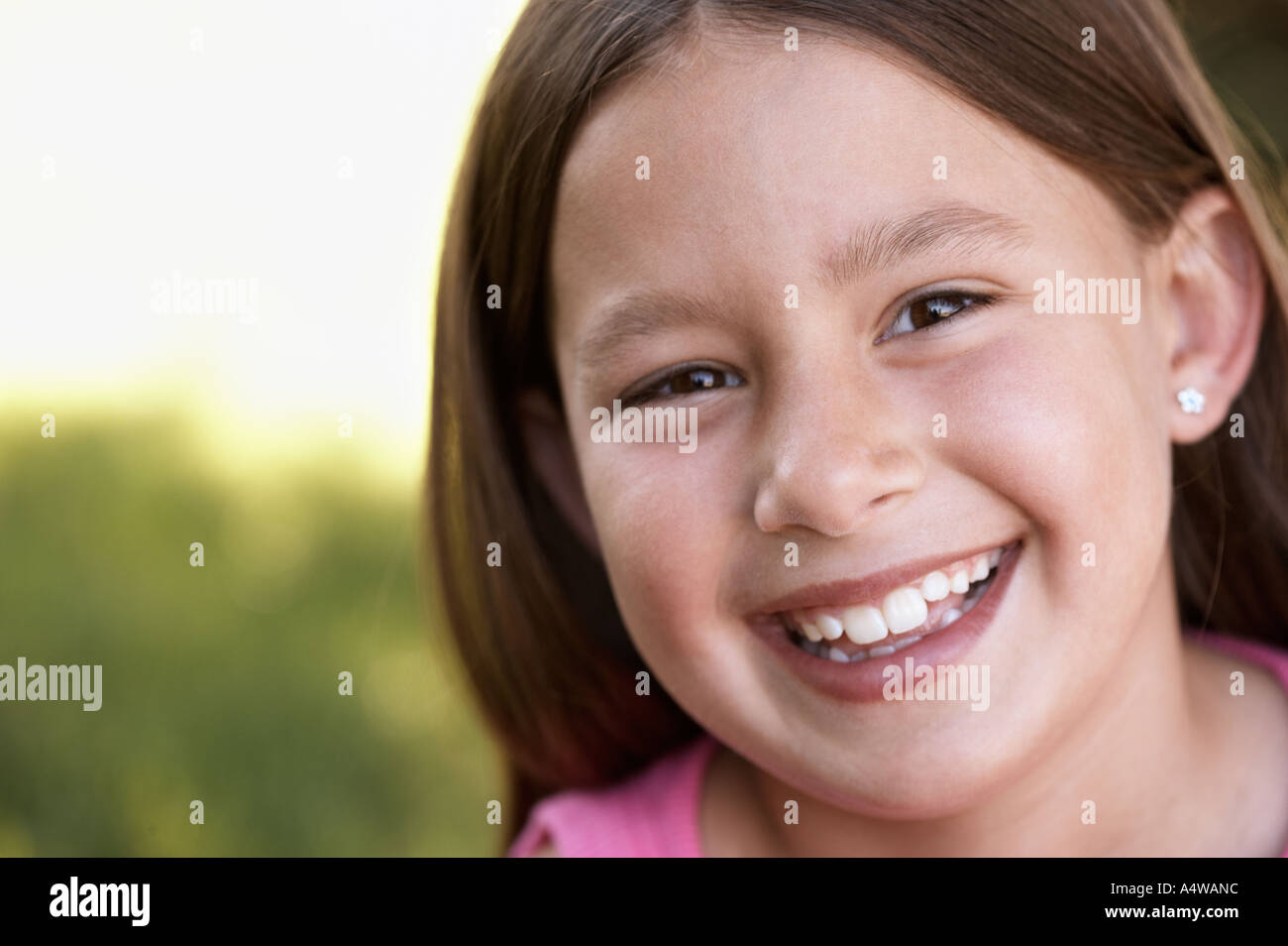 Portrait of young girl smiling taken outside Stock Photo - Alamy