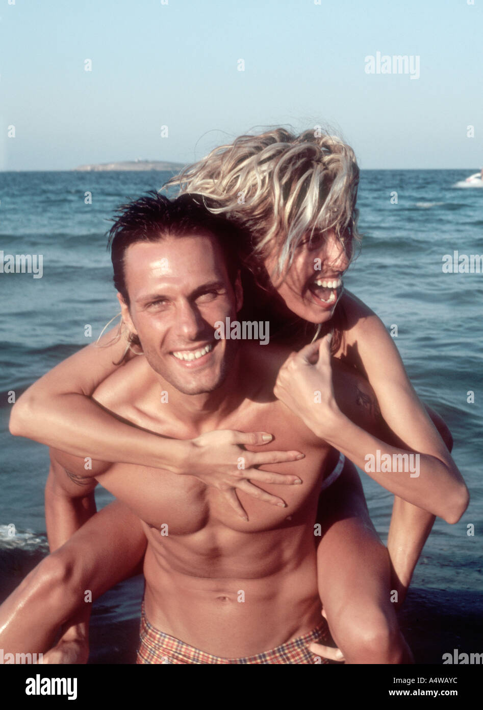Couple  having fun by the sea-side Stock Photo