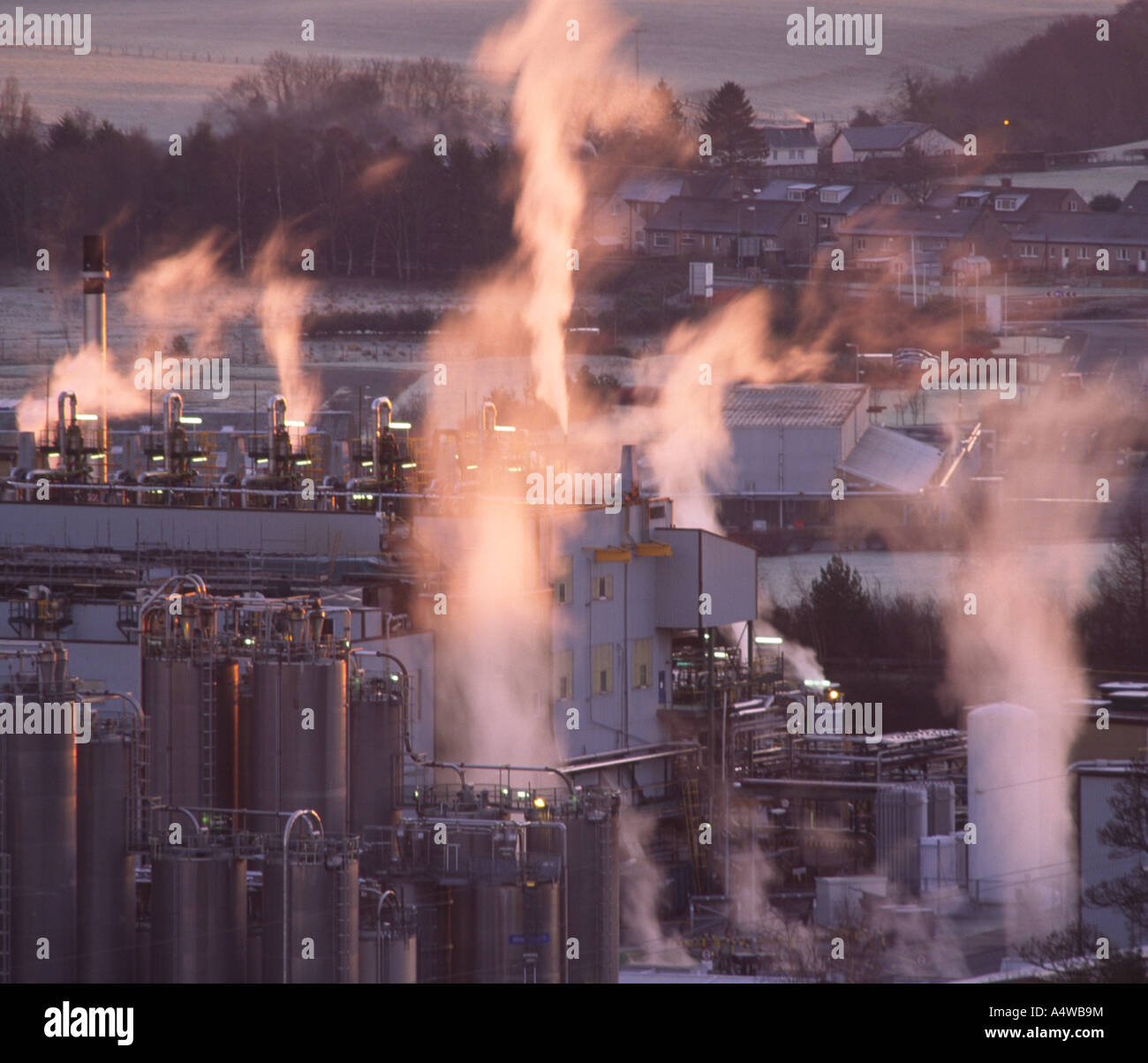 Pollution smoke rising from factory chimneys from an industrail chemical site polluting the enviroment Scotland UK Stock Photo