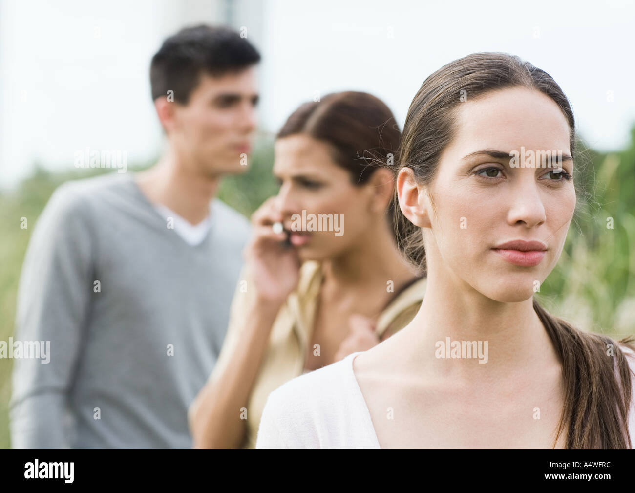 Young woman looking into the distance in park Stock Photo