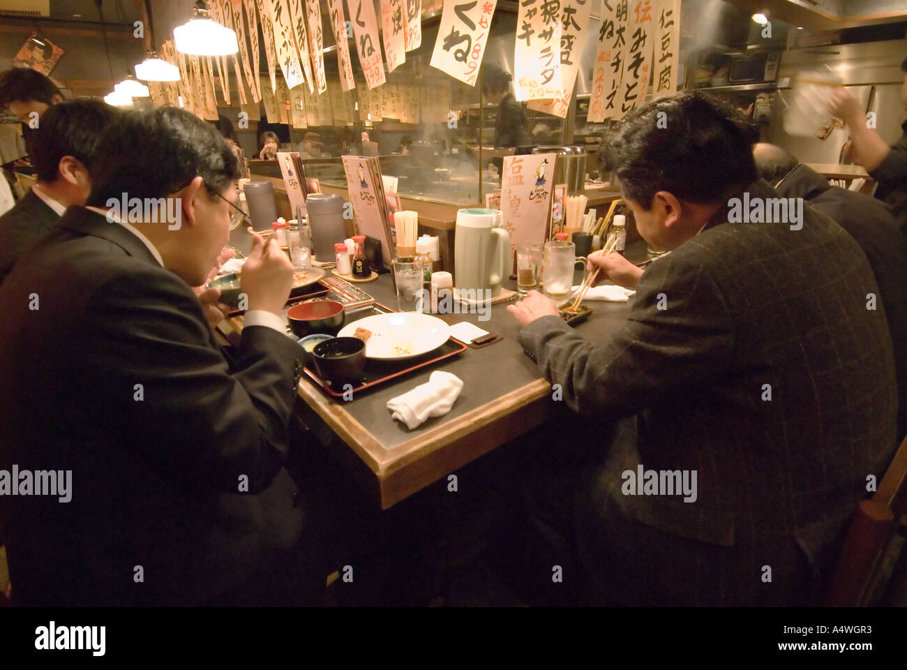 People eat a meal  at an izakaya restaurant in Sapporo Hokkaido Japan Stock Photo