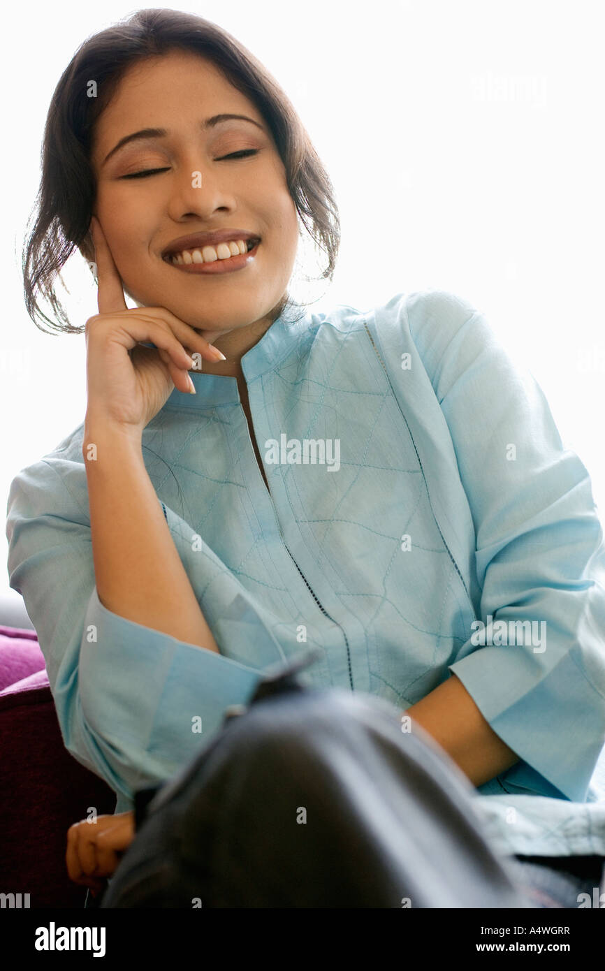 Woman resting chin in hand Stock Photo Alamy