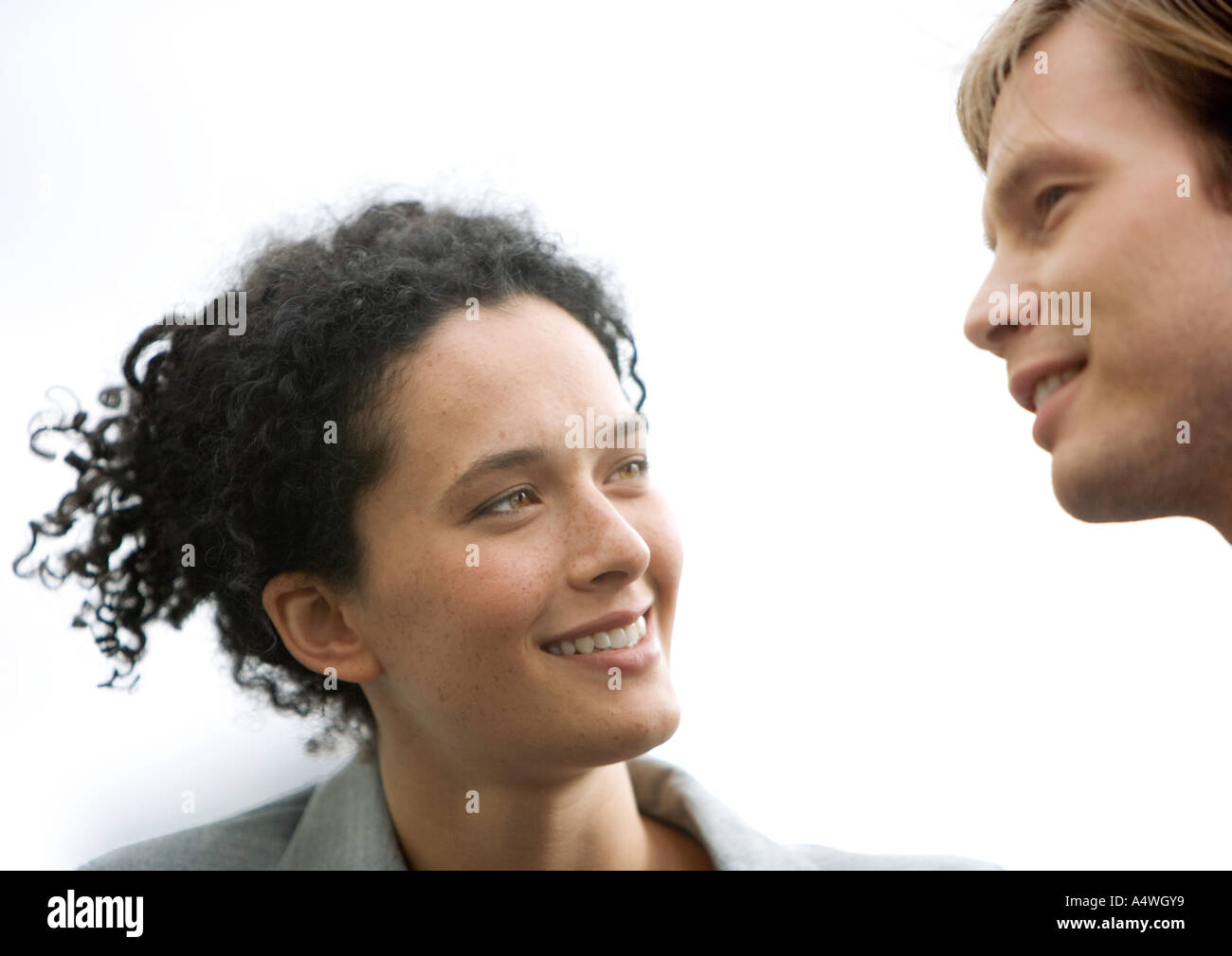 Woman and man conversing Stock Photo