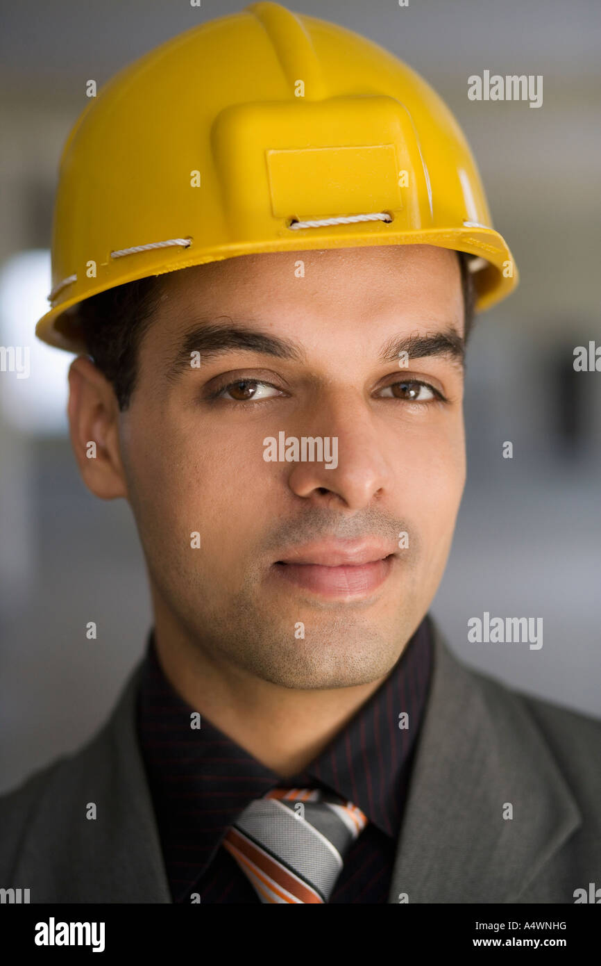 Businessman wearing a hard hat Stock Photo Alamy