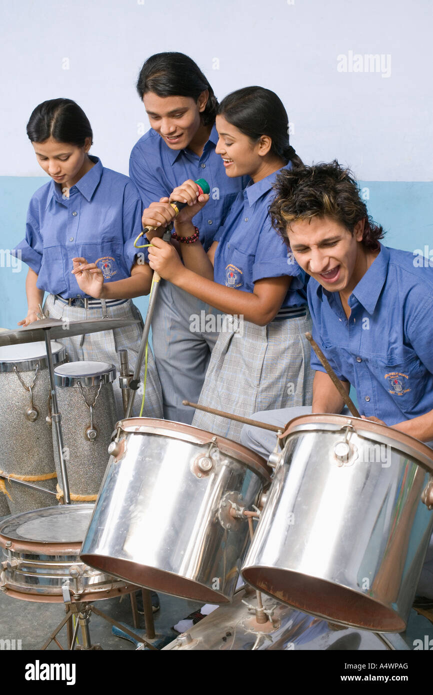 Students playing percussion instruments and singing Stock Photo Alamy