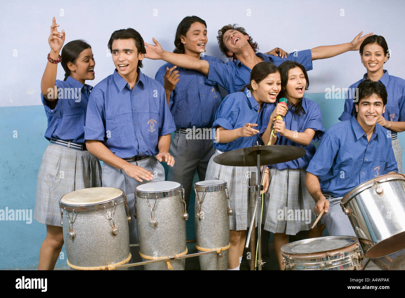 Students playing percussion instruments and singing Stock Photo Alamy