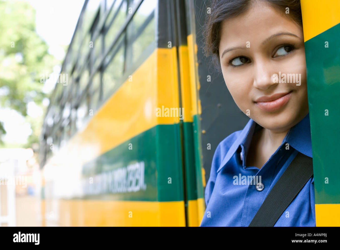 Female student standing in school bus door Stock Photo Alamy