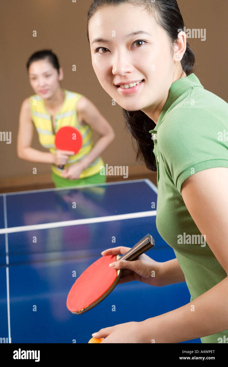 Young women playing table tennis Stock Photo Alamy