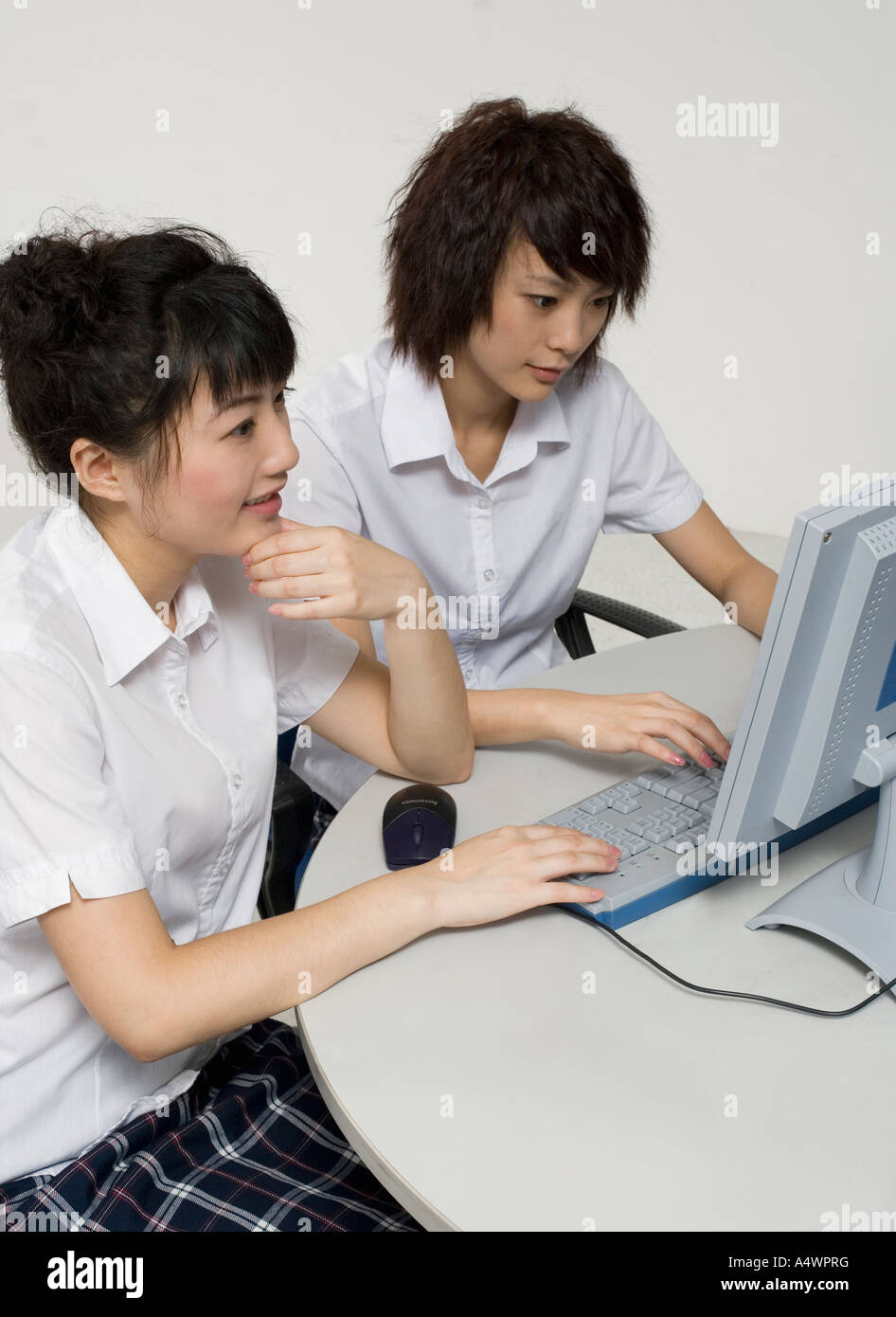 Female students working at a computer Stock Photo - Alamy
