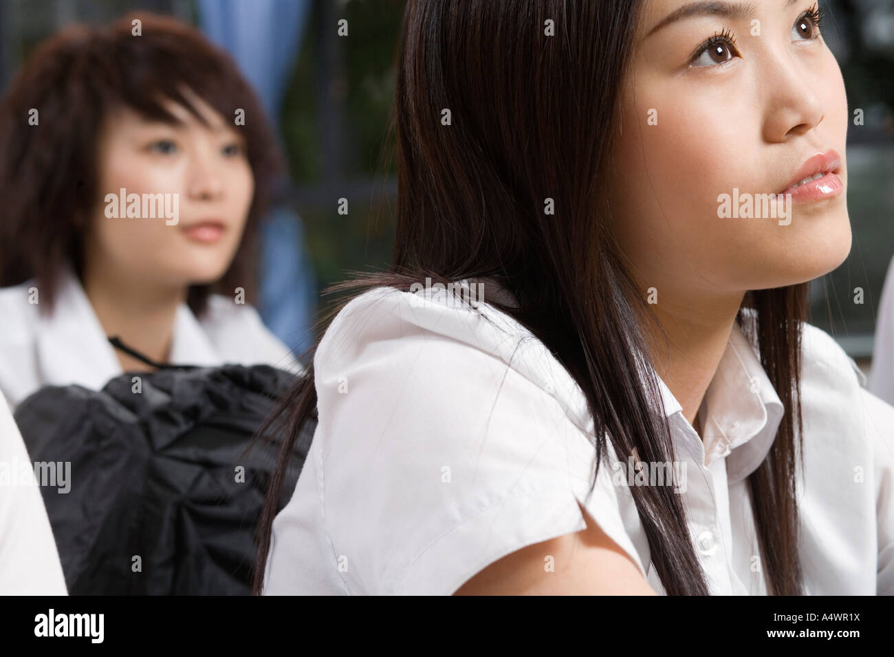 Female student paying attention in class Stock Photo - Alamy