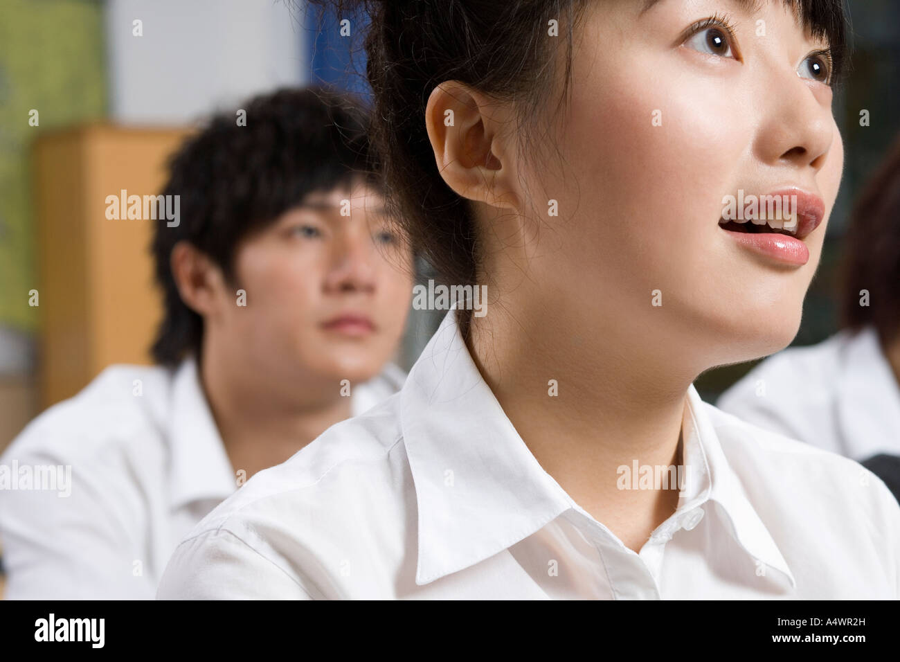 Female student paying attention in class Stock Photo - Alamy