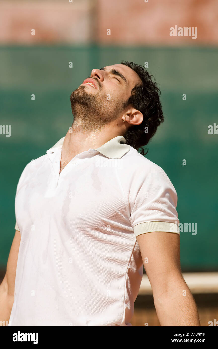Dejected male tennis player Stock Photo - Alamy