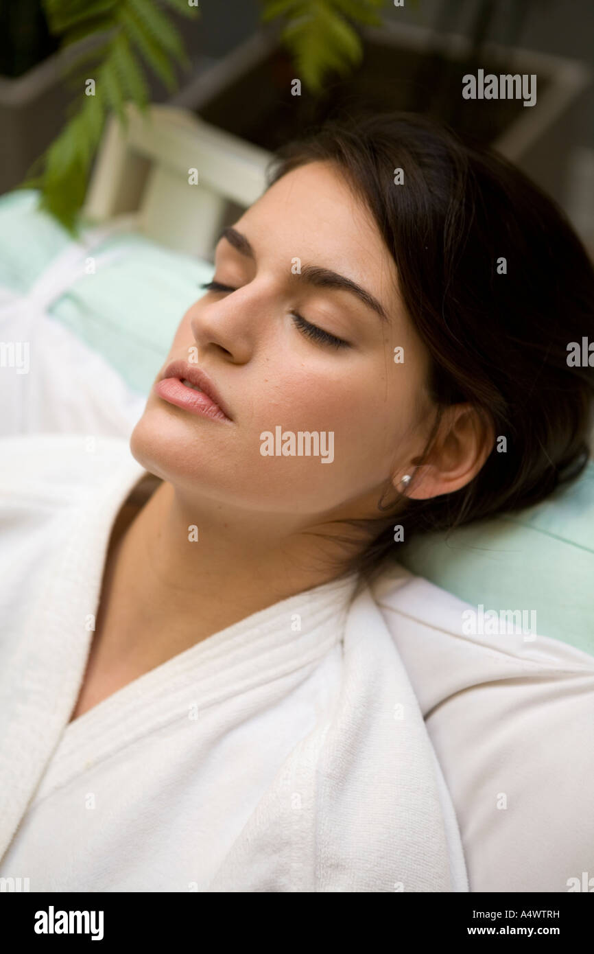 Woman sleeping in bathrobe Stock Photo Alamy