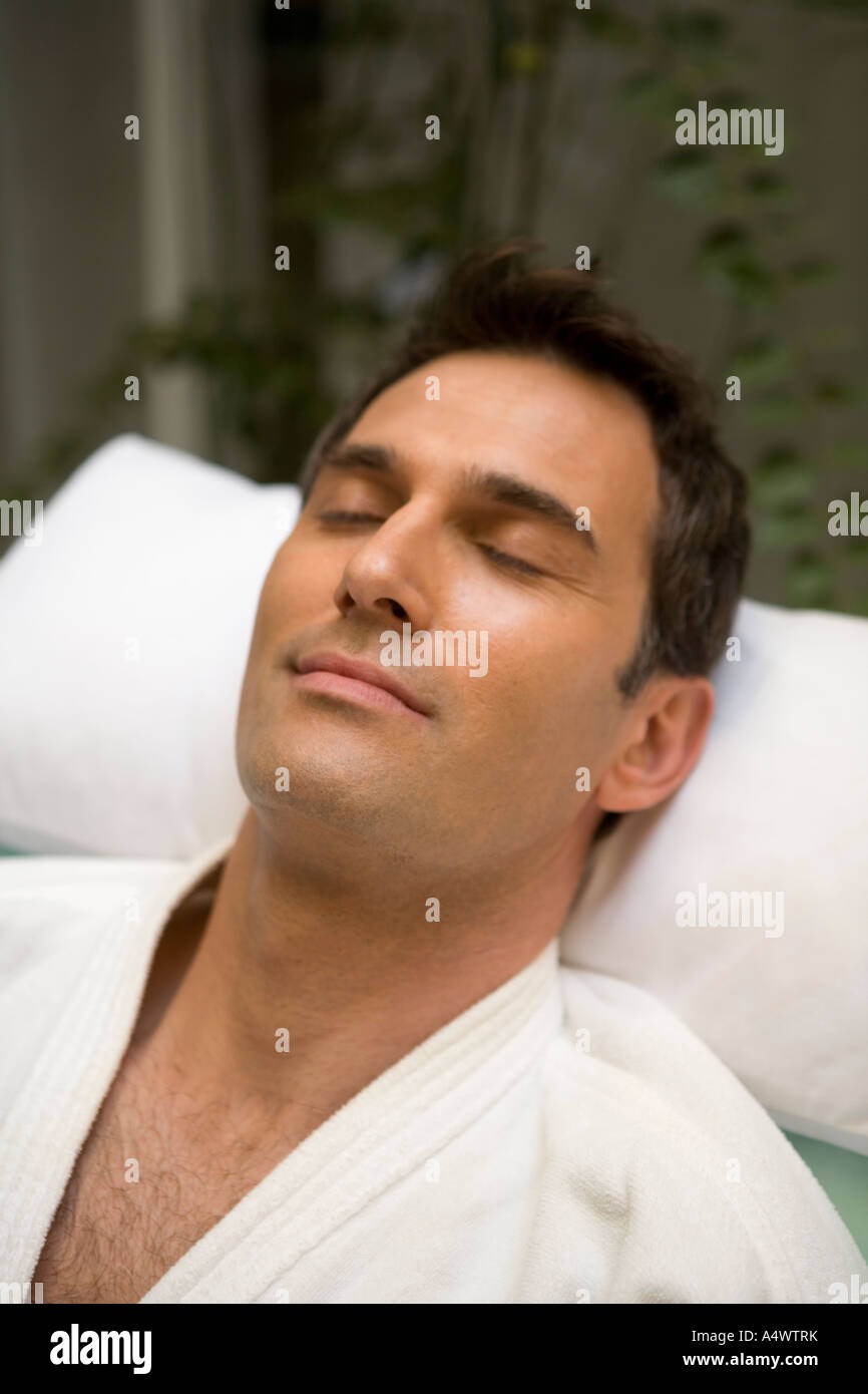 Man sleeping in bathrobe Stock Photo Alamy