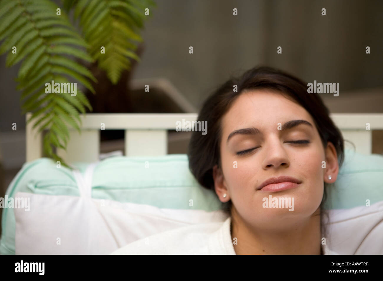 Woman sleeping in bathrobe Stock Photo Alamy