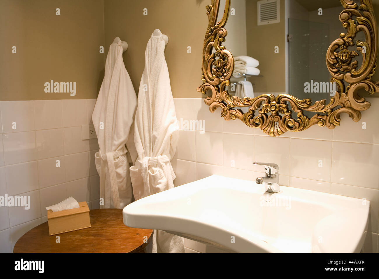 Bathrobes hanging in bathroom Stock Photo Alamy