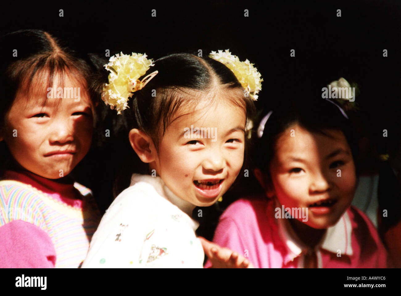 Inquisative chinese girls at the temple Stock Photo