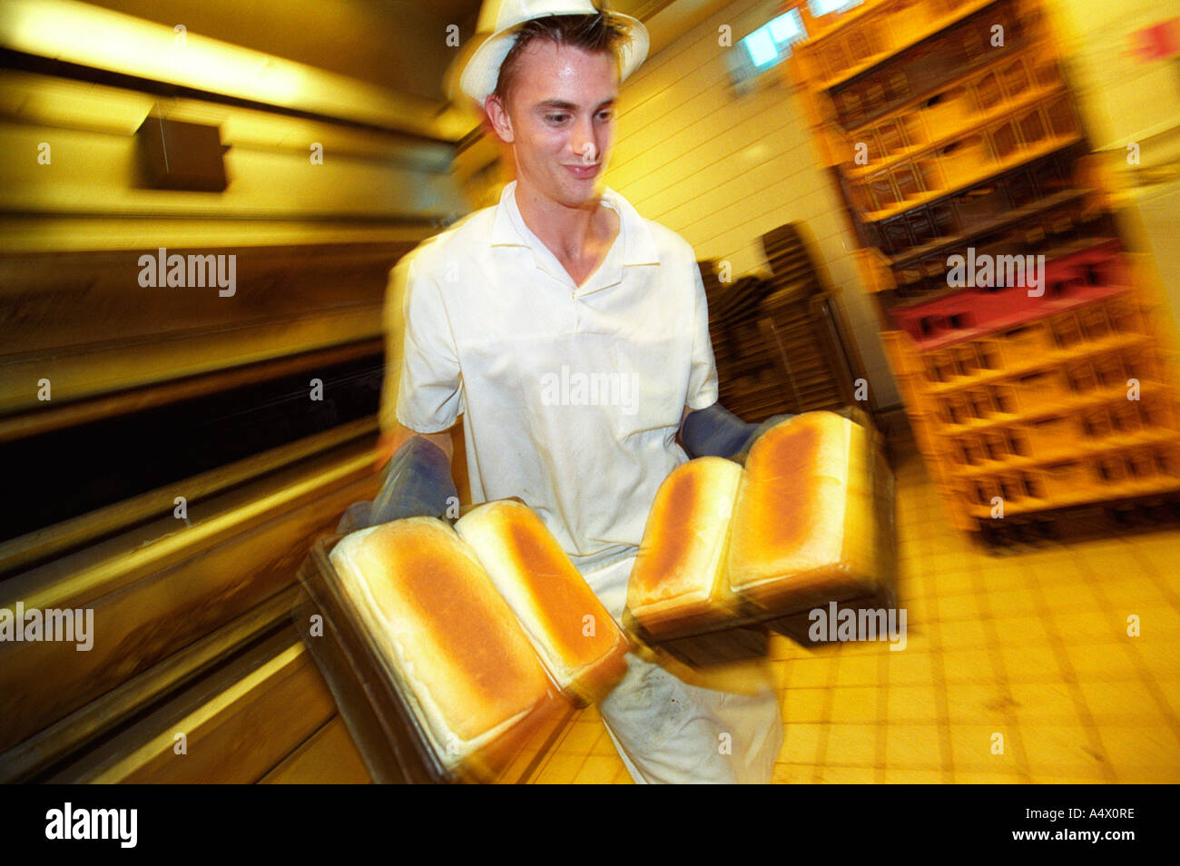 A baker working in a UK supermarket bakery Stock Photo Alamy