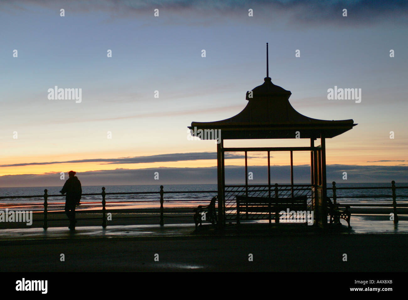 Silhouette of a Blackpool tram stop at dusk Stock Photo