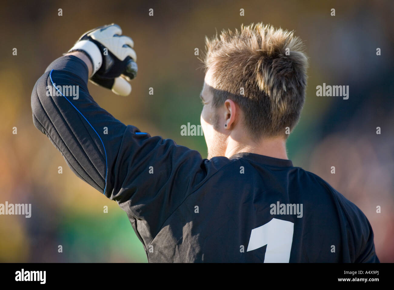 Goalkeeper blinded by the sun Stock Photo