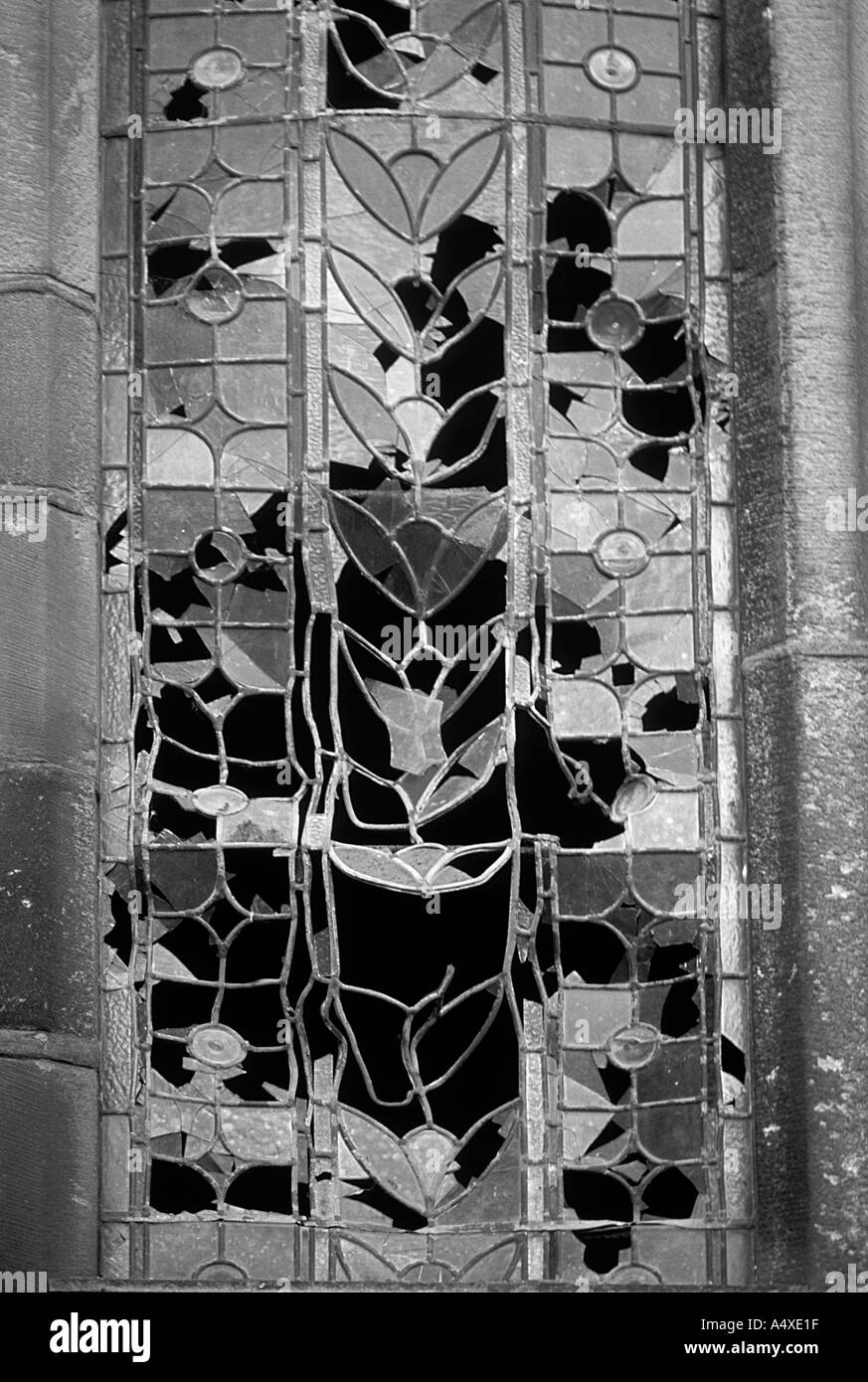 HERITAGE UNDER THREAT Broken stained glass windows by vandals UK Stock