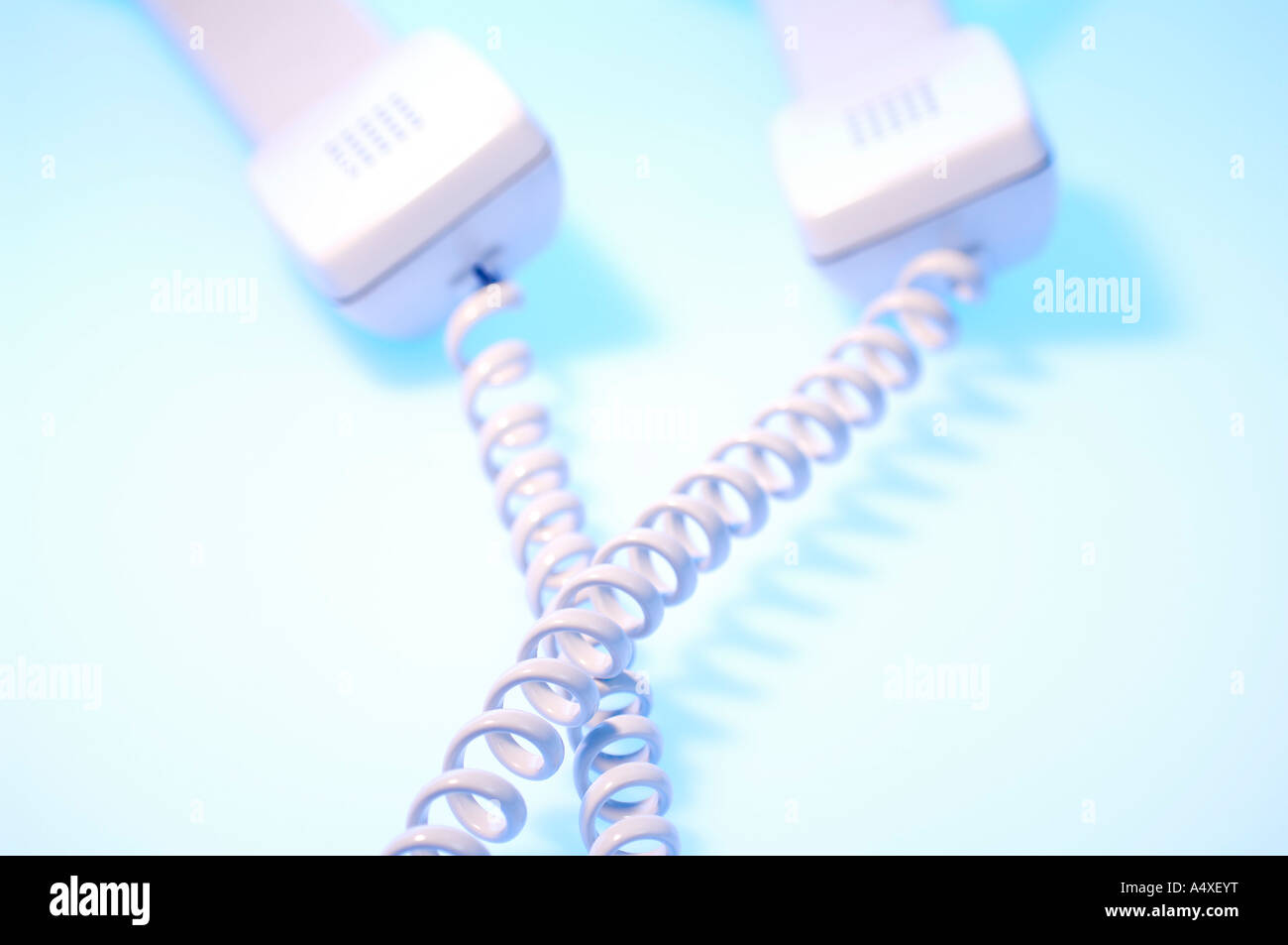 Two telephone receivers with cables Stock Photo Alamy