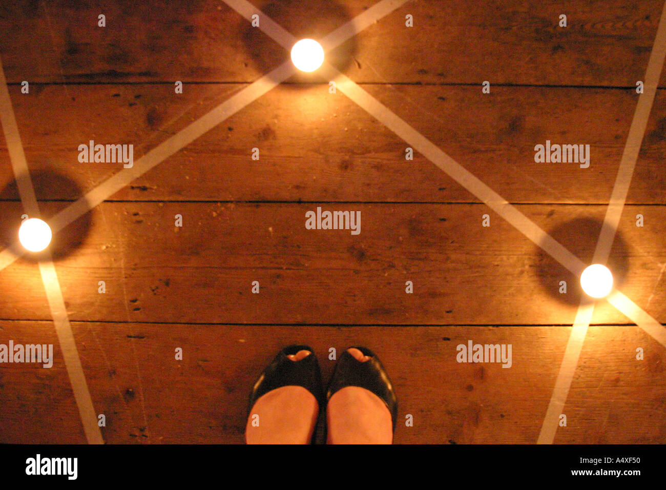 girl standing in a pentagram from above Stock Photo