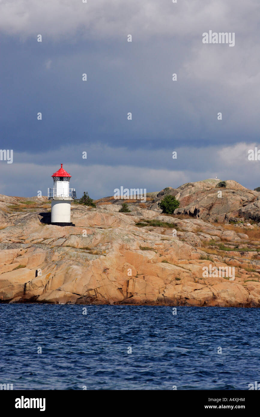 Little lighthouse at the swedish Baltic Sea coast with granite rocks ...