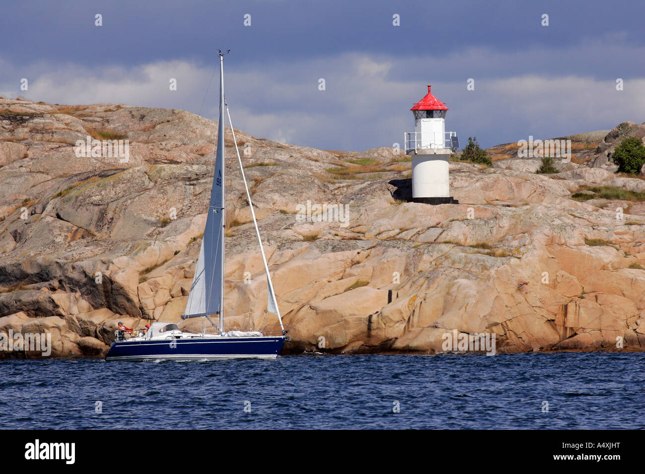 Little lighthouse at the swedish Baltic Sea coast with granite rocks ...