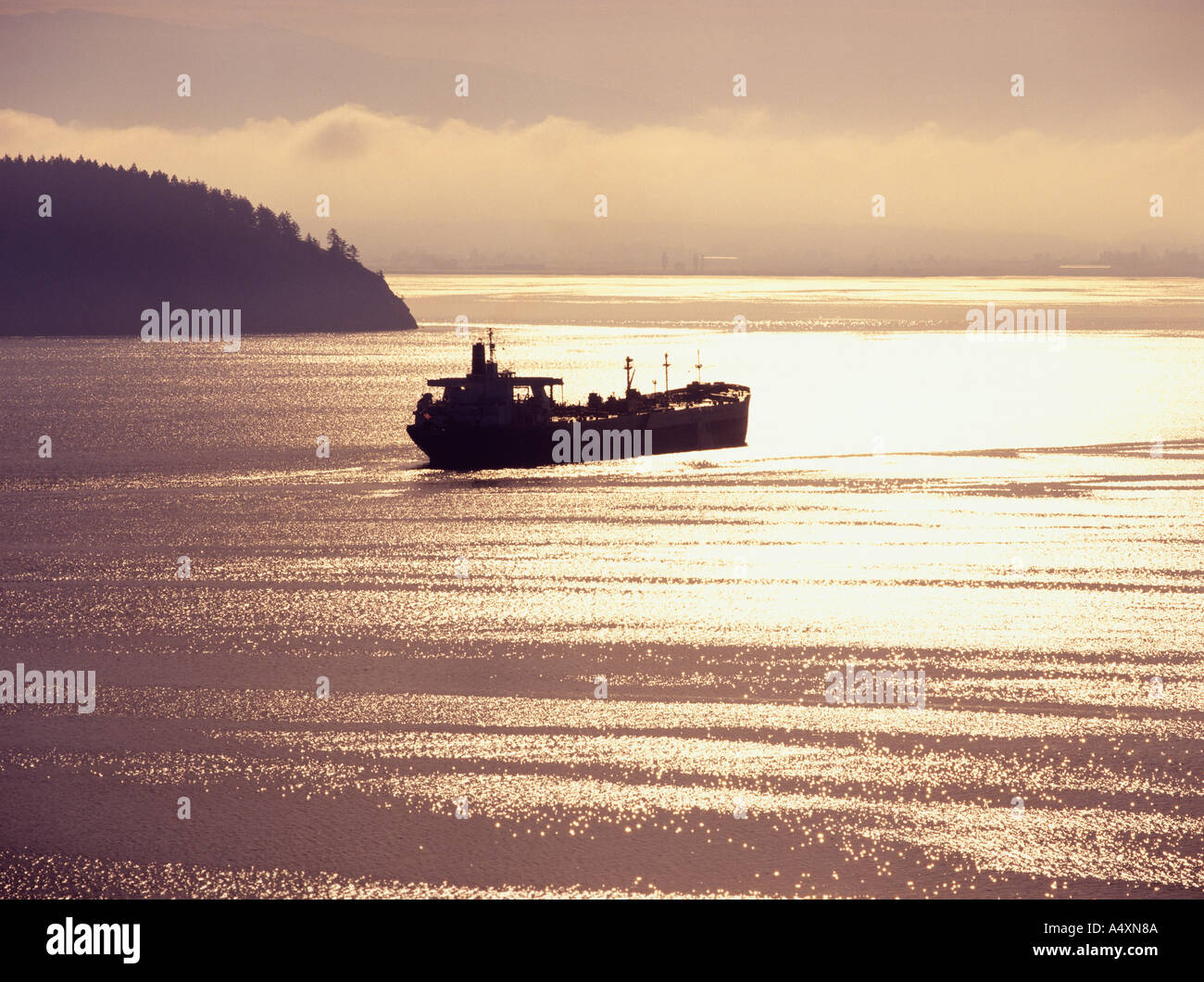 Cargo ship plies the waters around the San Juan Islands of Puget Sound ...