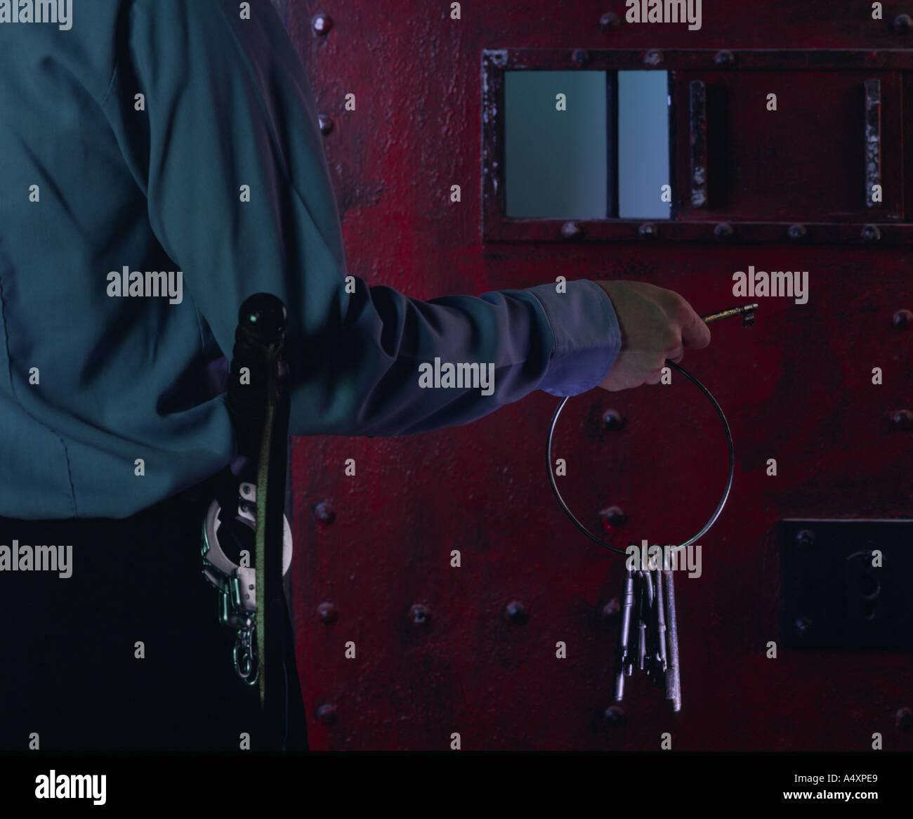 prison guard unlocking door Stock Photo Alamy
