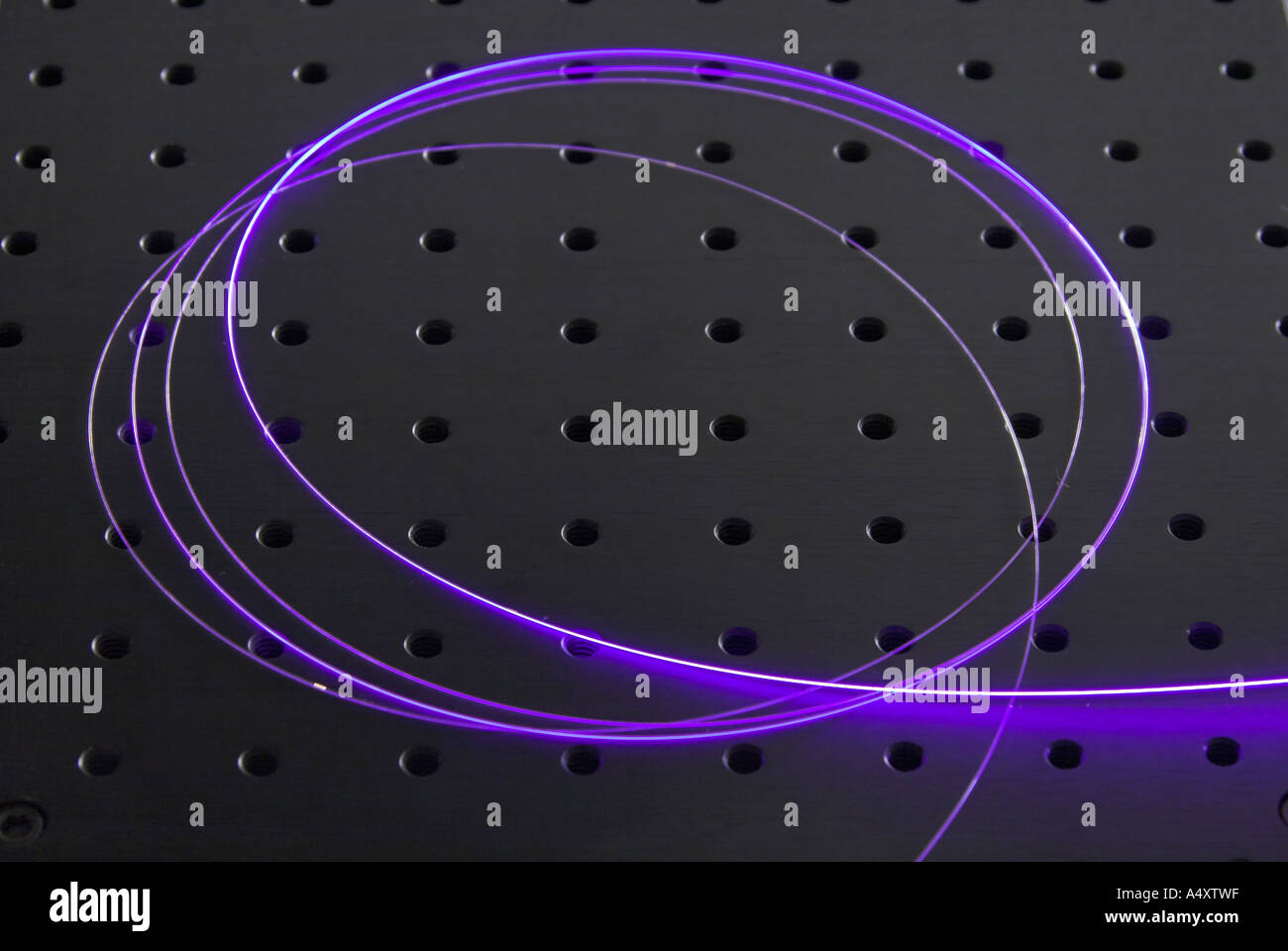 A claddingpumped doped optical fiber is used in a laser laboratory for