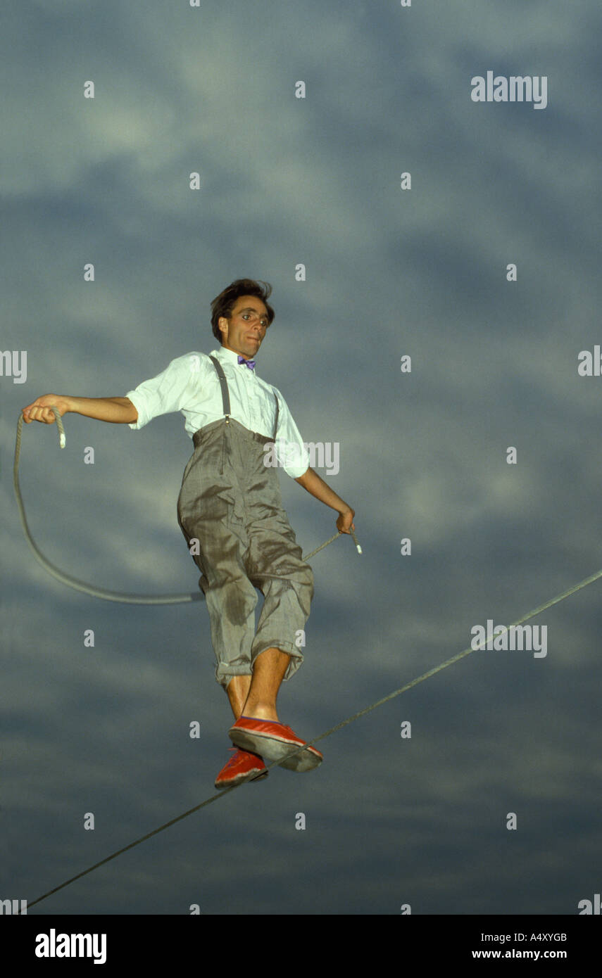 Rope dancer. Skipping. Man jumping with a rope on a rope Stock Photo