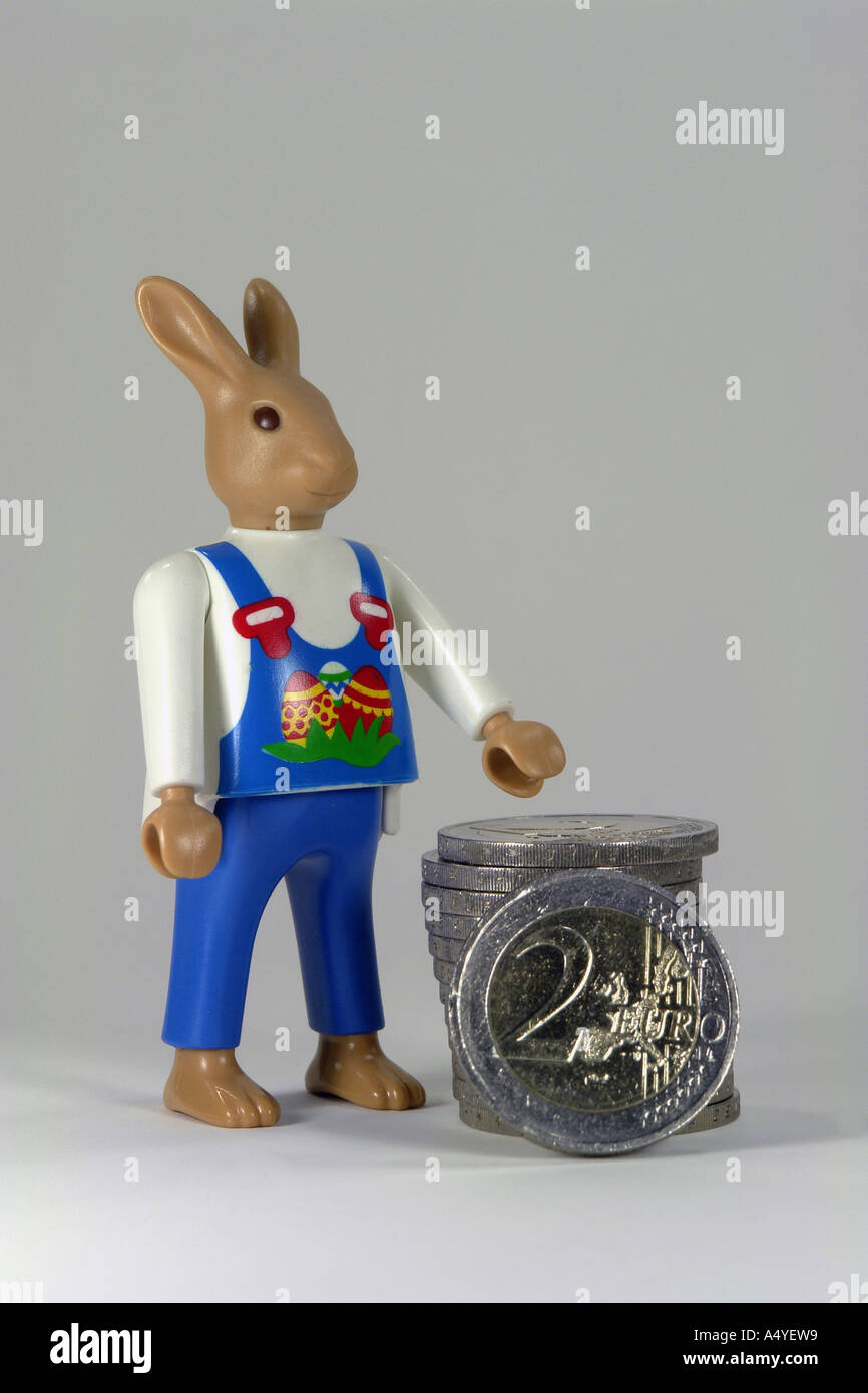 Easter bunny with euro coins as symbole for expensive easter shopping Stock Photo