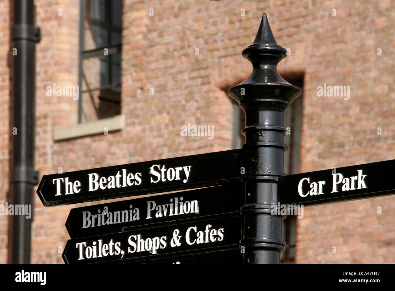 Pedestrian signs The Beatles story museum music musical Liverpool arch logo experience magic architecture mill re use industria Stock Photo