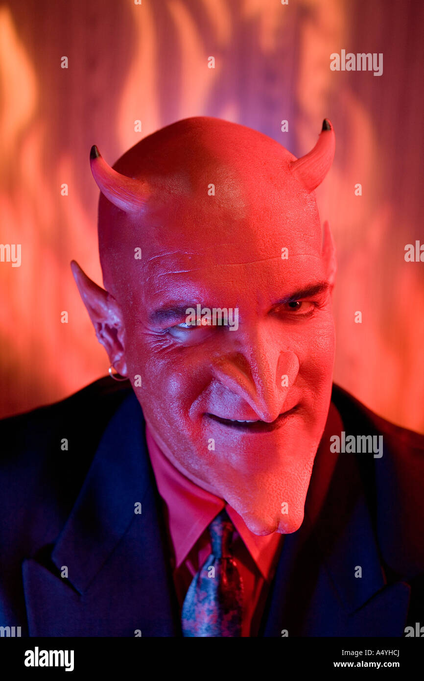 Close up of businessman dressed as devil Stock Photo