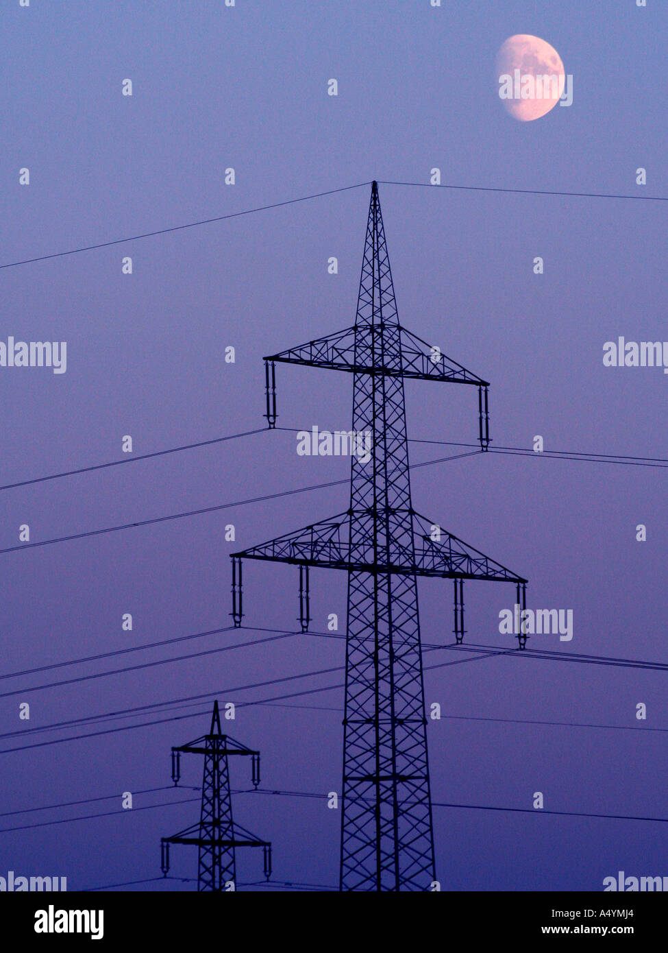 Power supply pylon in moonlight Stock Photo Alamy