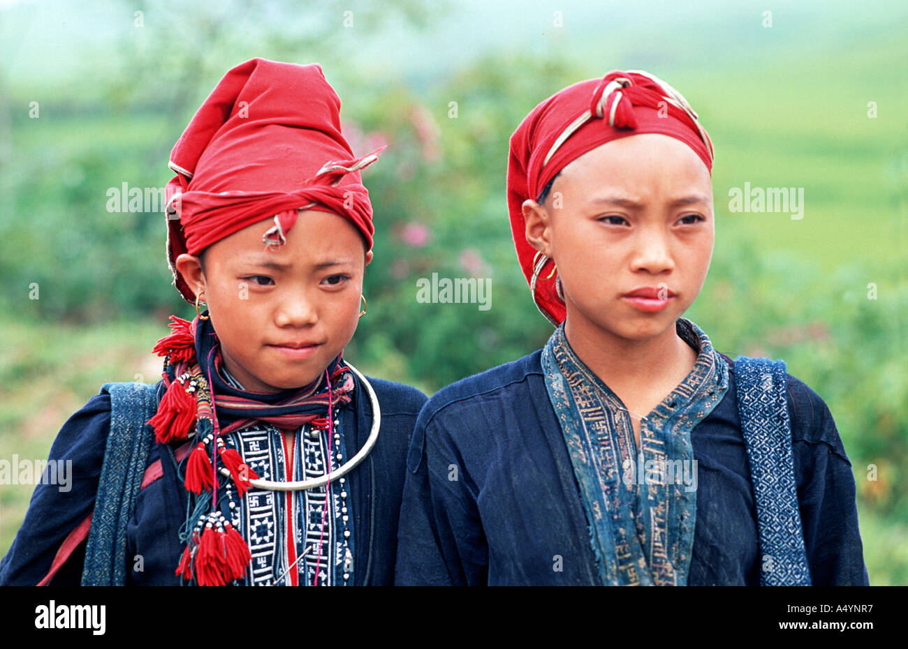 Girls from the Red Dao Dzao hilltribe in distinctive tribal costume Sapa Vietnam Stock Photo