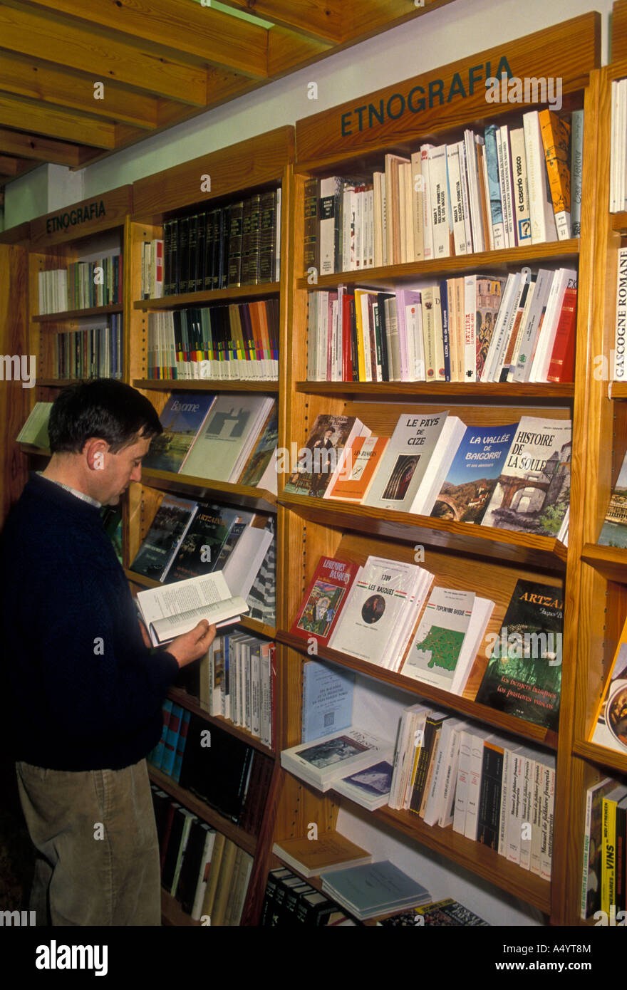 Frenchman, French man, reading book, buying book, bookstore,