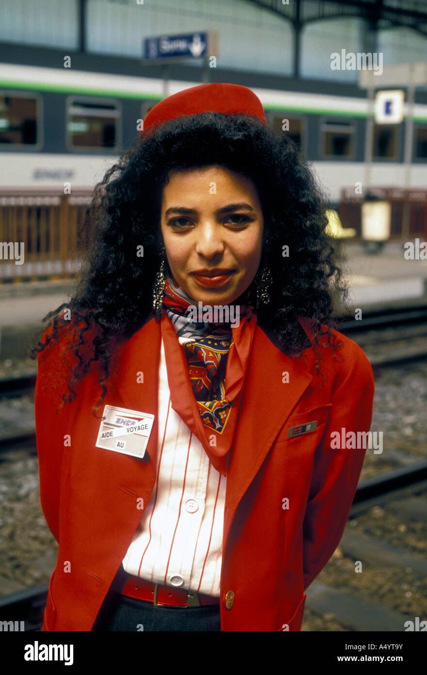 French woman, French, woman, North African woman, adult woman, eye contact, front view, SNCF, aide au voyage, Gare de Bayonne, Bayonne, France Stock Photo