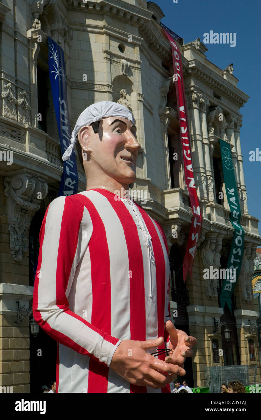Gigante (giant) wearing Bilbao football club shirt during parade, Aste Nagusia fiesta,  Plaza Arriaga, Basque Country, Spain. Stock Photo