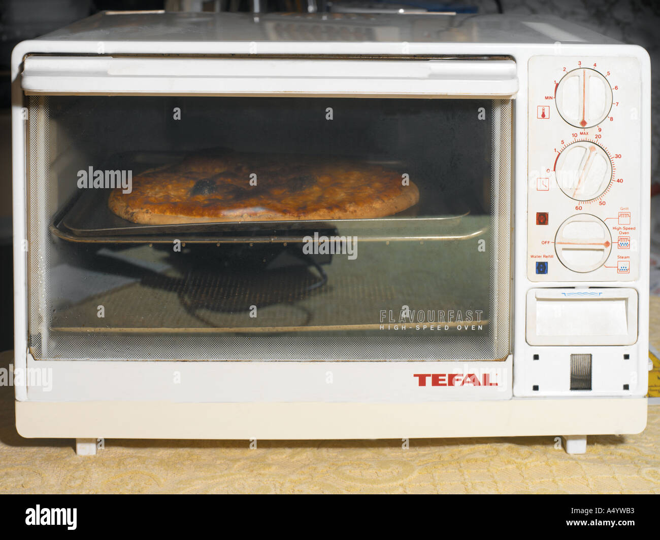 Pizza Cooking in High Speed Oven Stock Photo Alamy